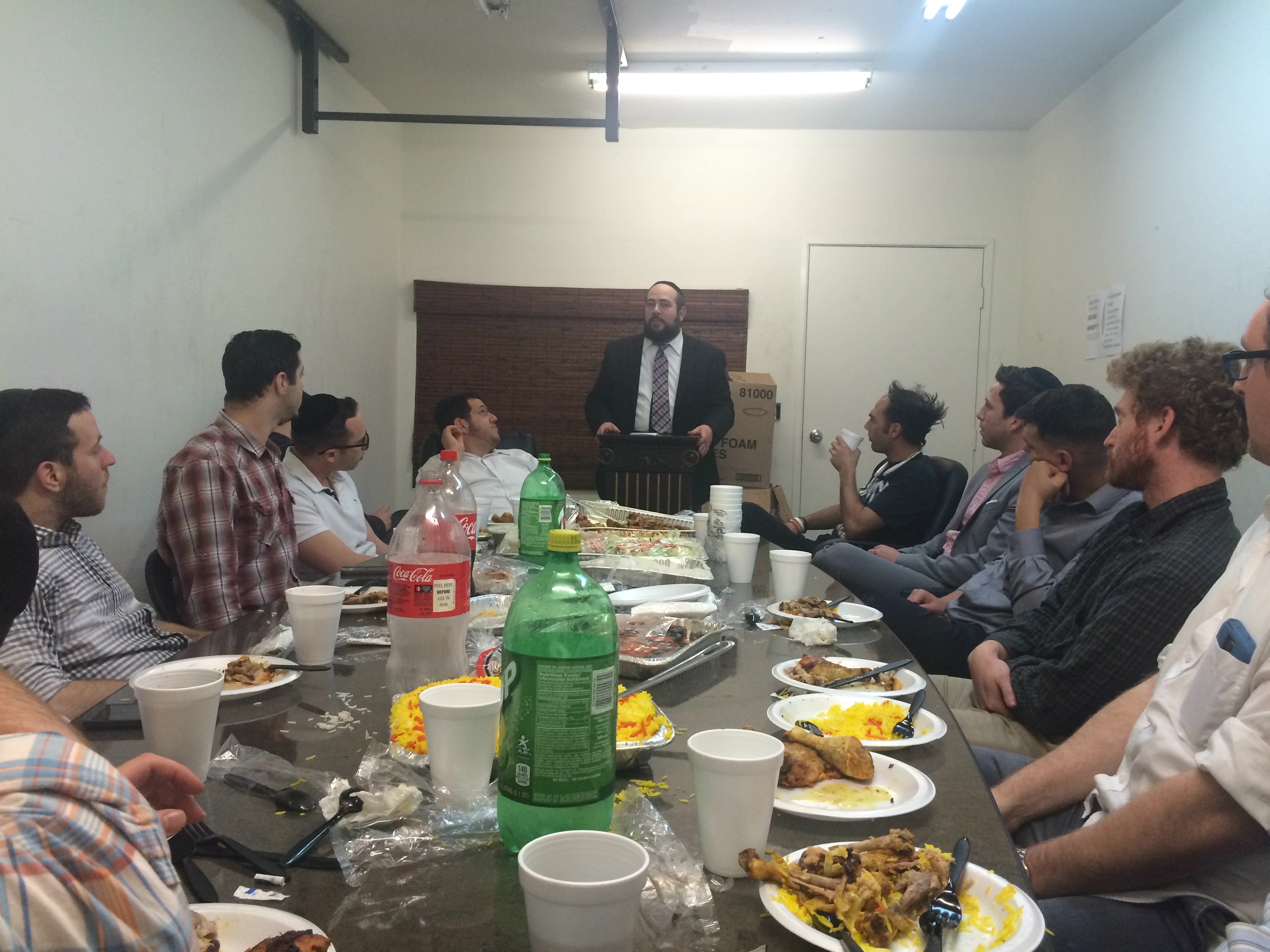 The Rav speaking to the table after a meal